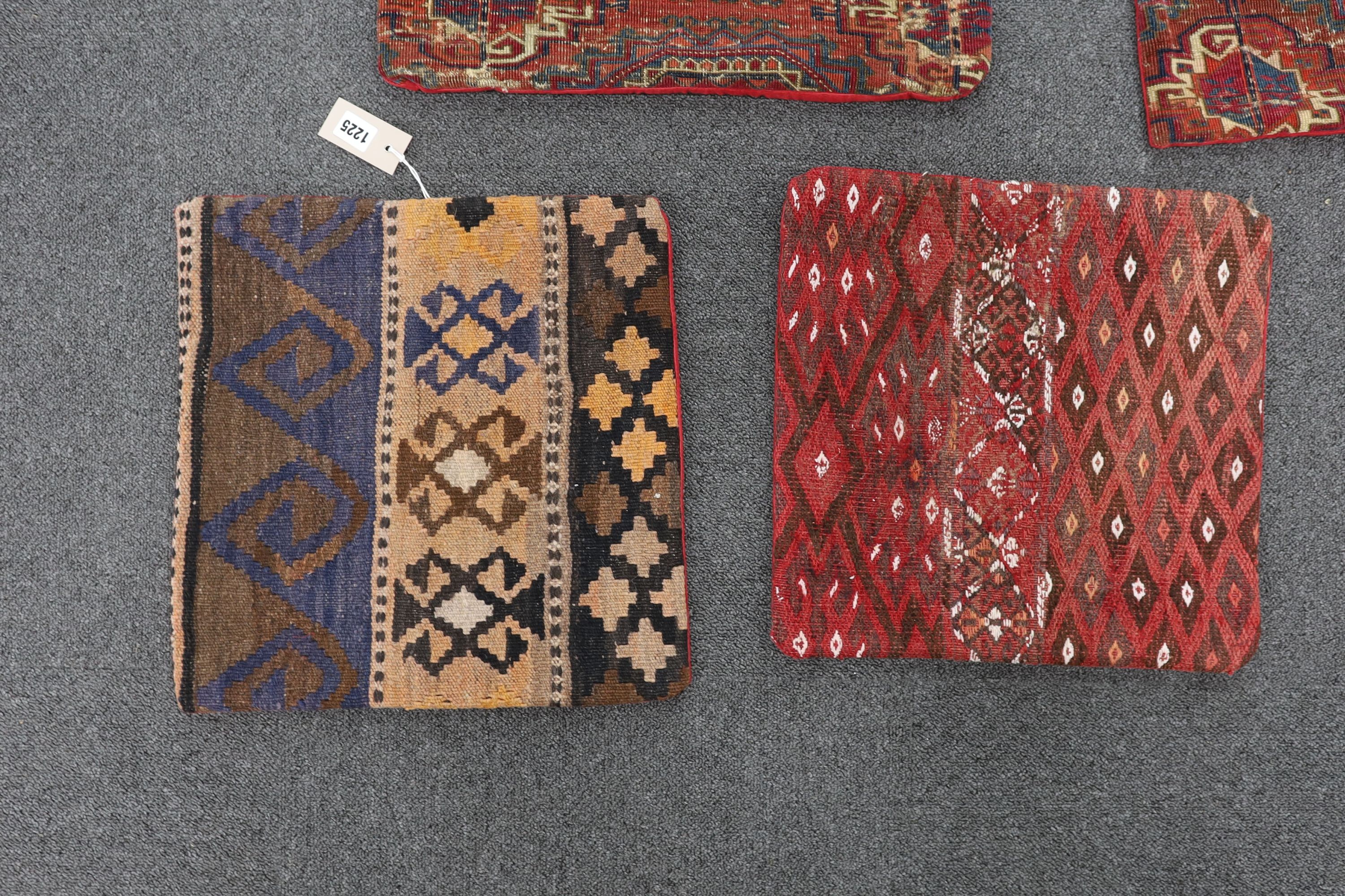 Five assorted Kilim and Tekke carpet cushion covers, largest 48 x 48cm